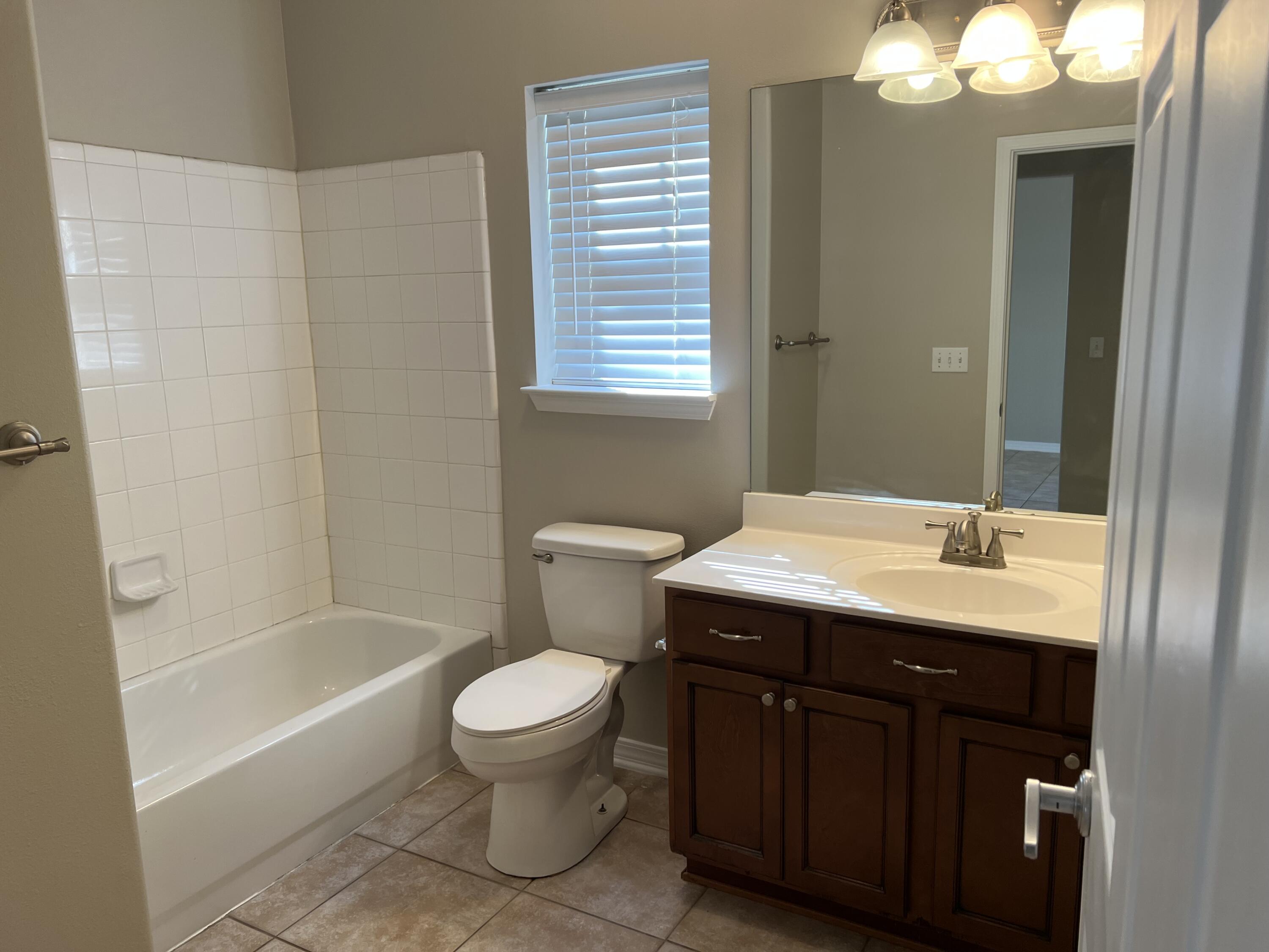 8 Myrtle Oak Way Santa Rosa Beach, FL 32459 - Photo 11 of 29 a bathroom with a sink a toilet and a bathtub