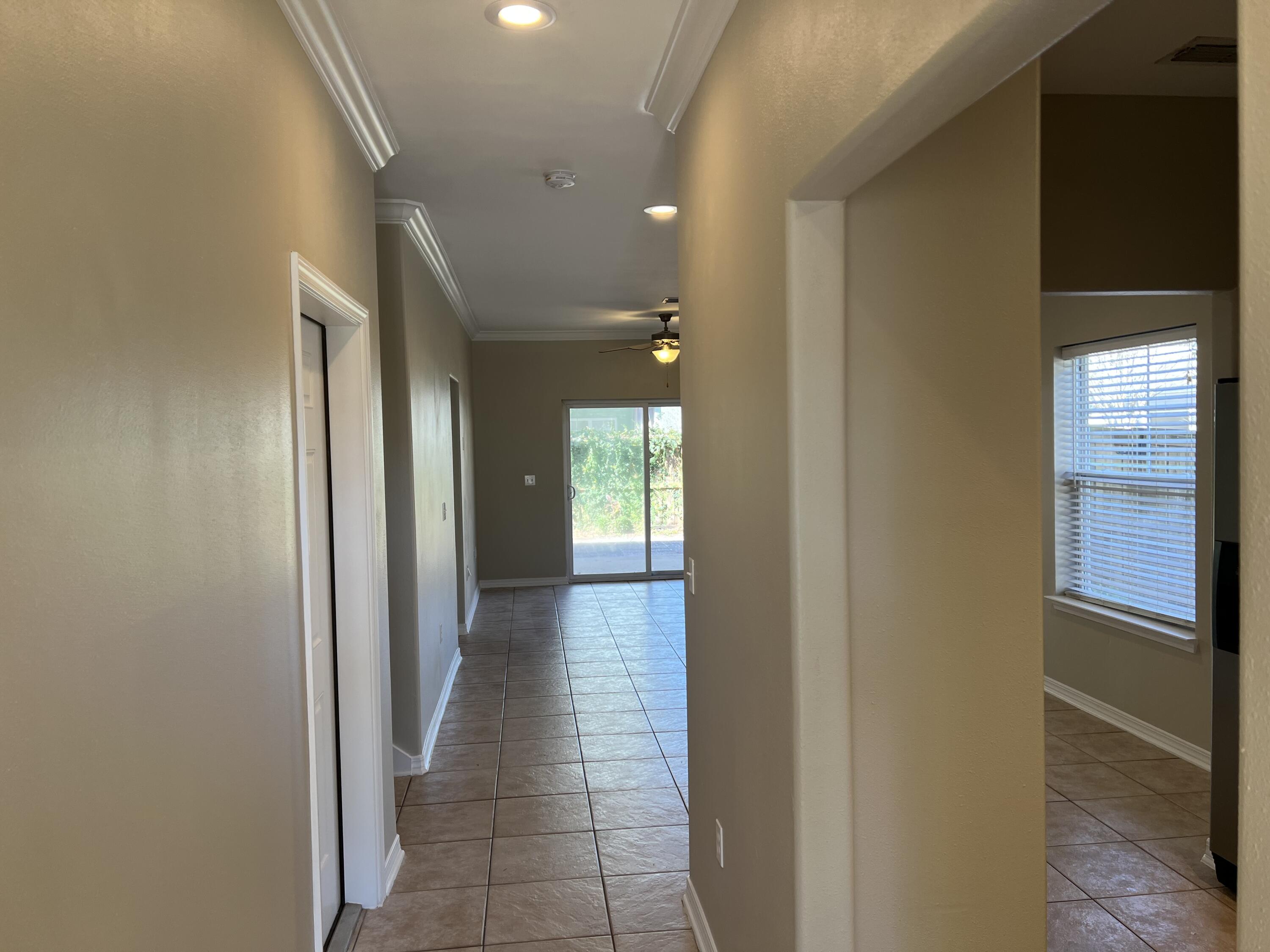 8 Myrtle Oak Way Santa Rosa Beach, FL 32459 - Photo 2 of 29 a view of a hallway with wooden floor and windows
