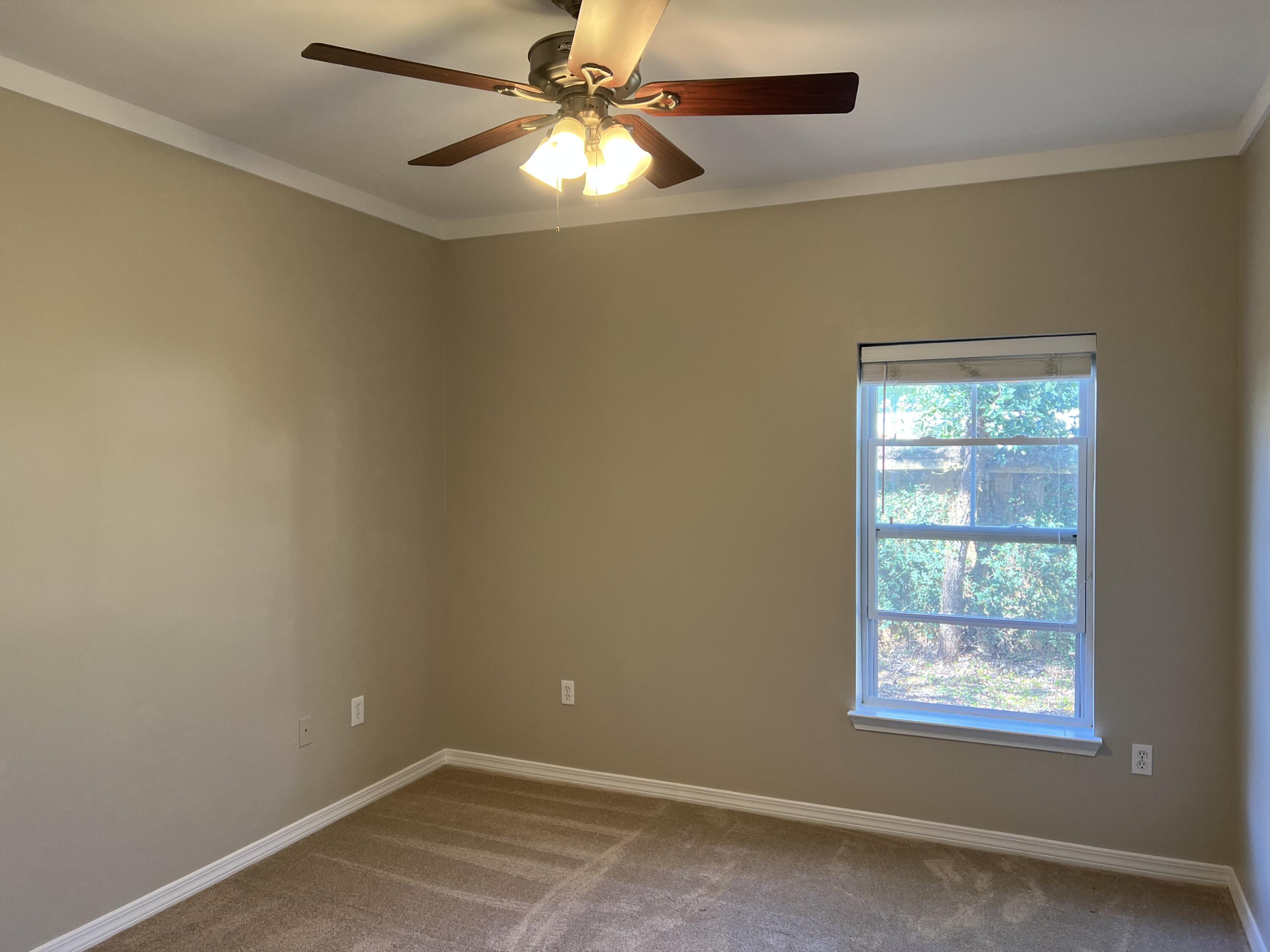 8 Myrtle Oak Way Santa Rosa Beach, FL 32459 - Photo 9 of 29 an empty room with a window and a fan