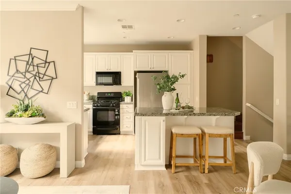 a kitchen with a table and chairs