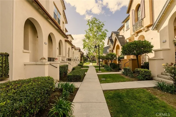 a view of a white apartments with large windows