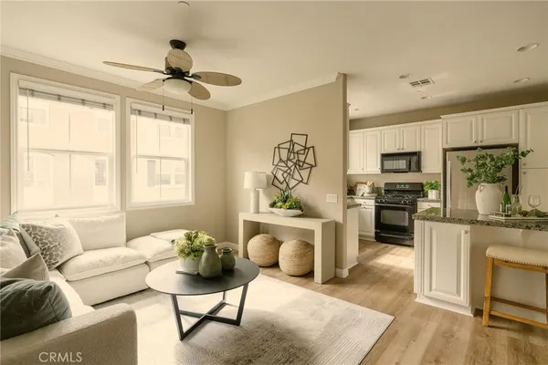 a living room with furniture and a fireplace