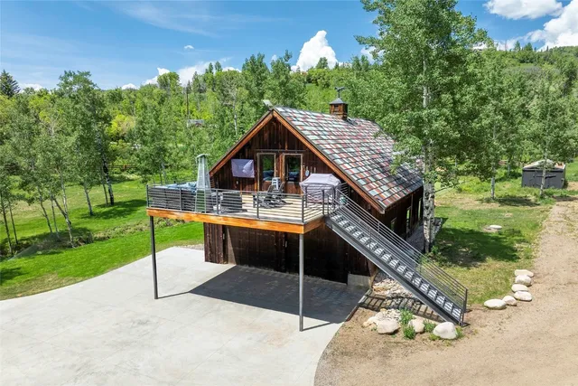 a kitchen with kitchen island granite countertop lots of counter top space and stainless steel appliances
