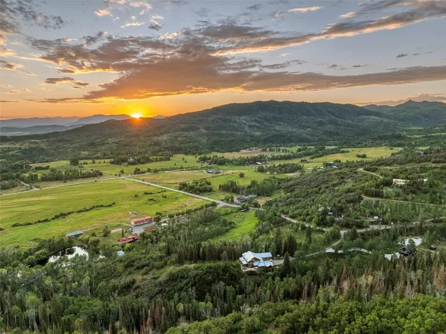 a view of an ocean and a mountain