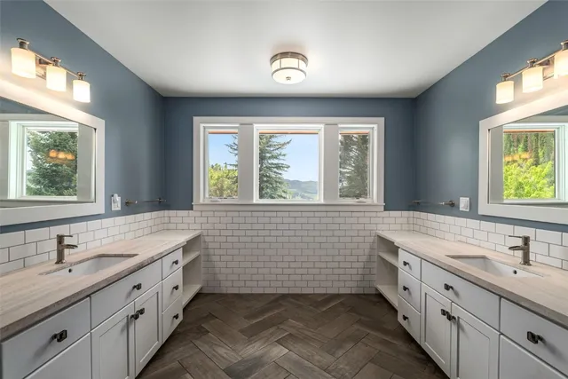 a bedroom with bed and window