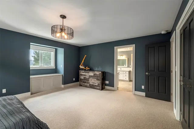 a bedroom with bed and a window