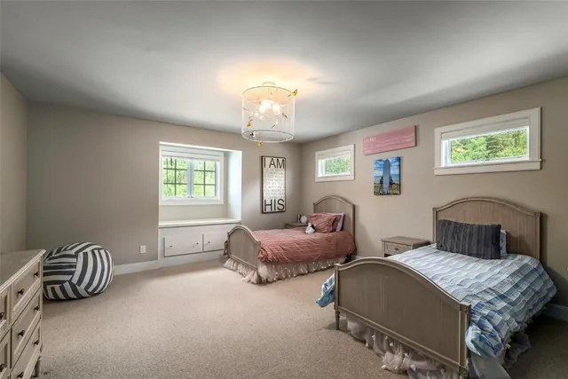 a bedroom with furniture and a window