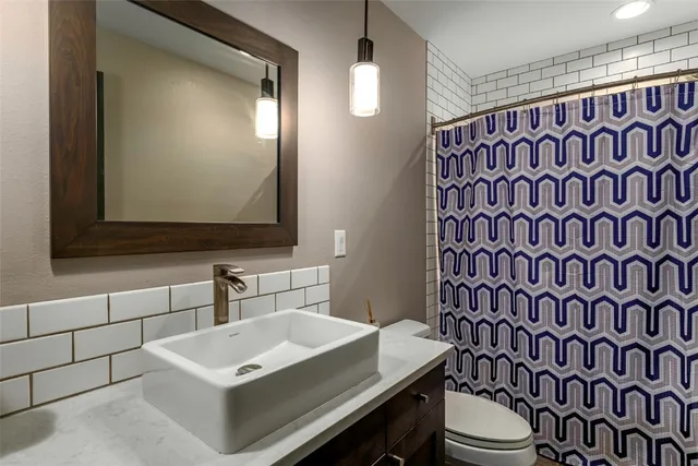 a bedroom with a bed and windows