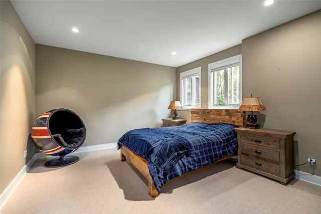 a bathroom with a sink shower and a mirror
