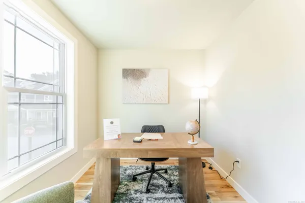a view of a workspace with furniture