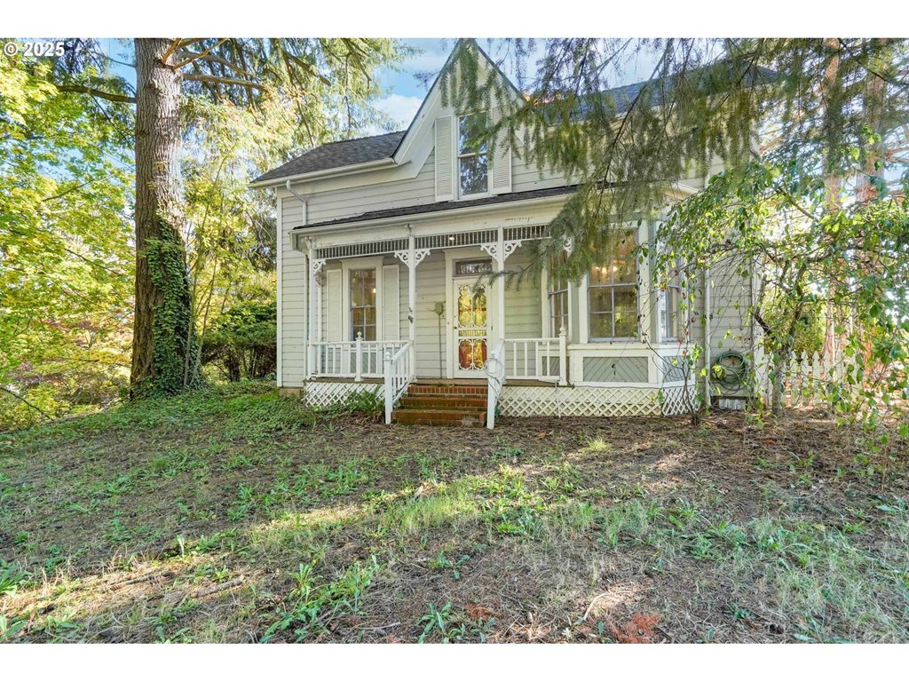 10478 Crosby Road Northeast Woodburn, OR 97071 - Photo 1 of 43 a view of a house with a backyard