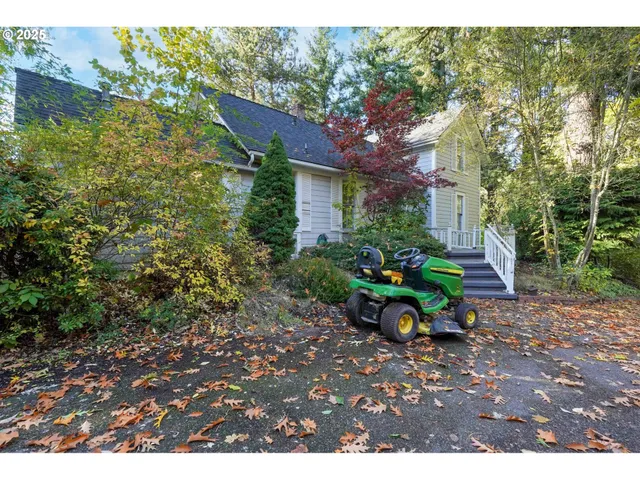 a backyard of a house with table and chairs