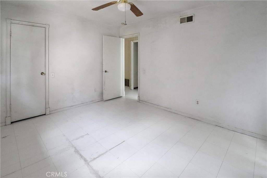 7554 Corbin Avenue, Unit 1 Reseda, CA 91335 - Photo 7 of 10 an empty room with chandelier fan