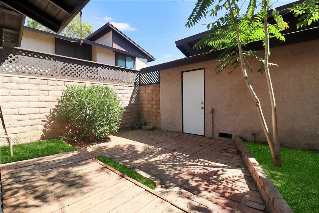 7554 Corbin Avenue, Unit 1 Reseda, CA 91335 - Photo 8 of 10 a front view of a house with garden