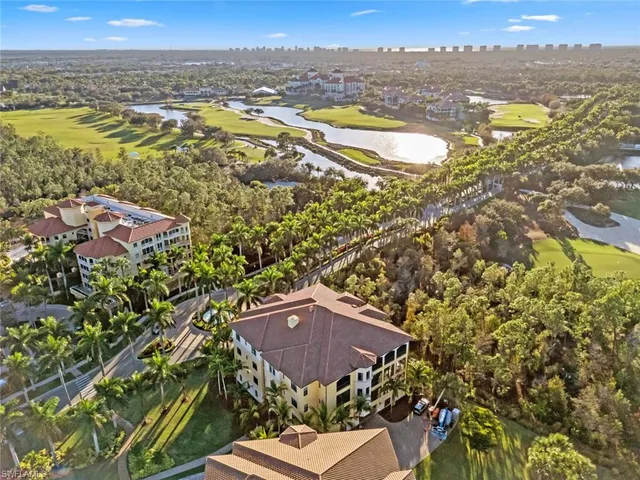 a bathroom with a granite countertop sink mirror and toilet