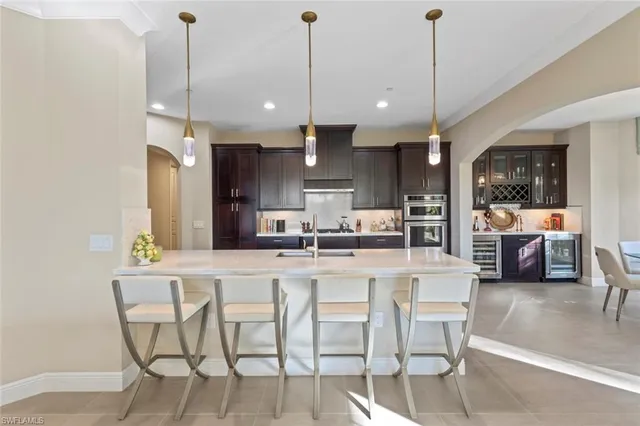 a large kitchen with stainless steel appliances lots of counter top space