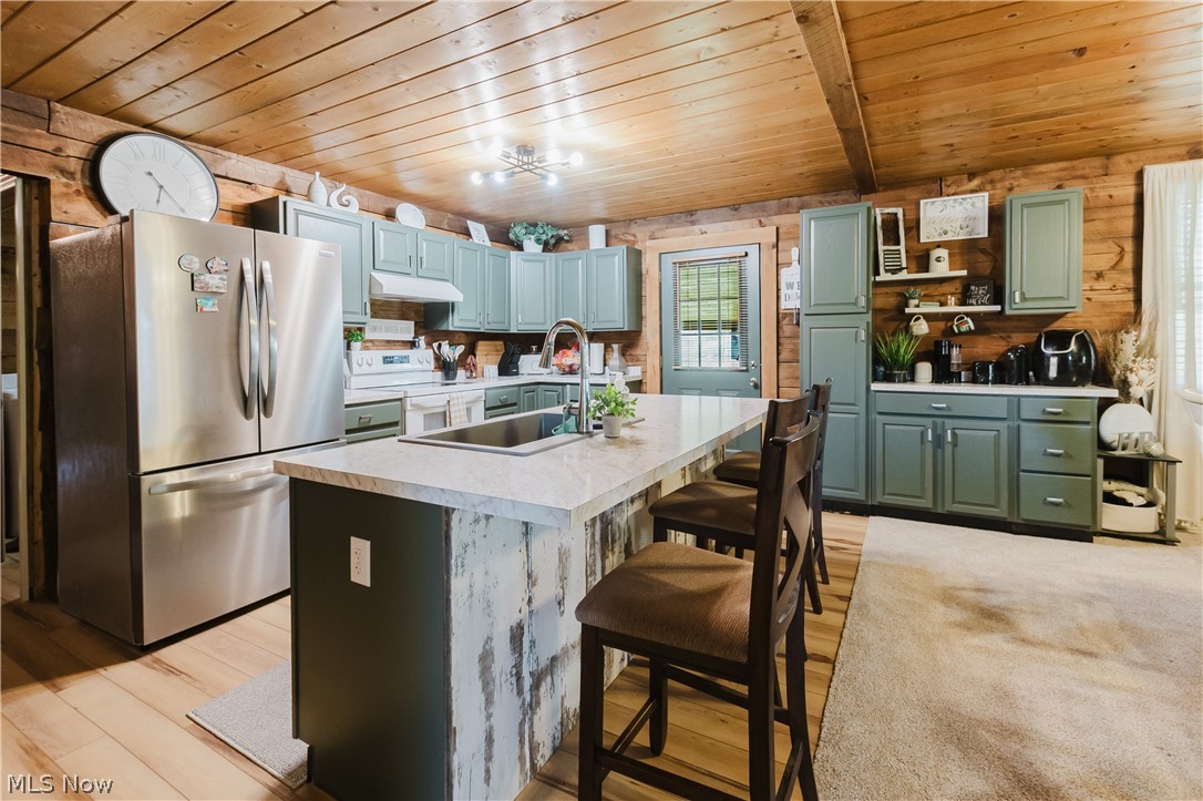 47480 Unionvale Road Cadiz, OH 43907 - Photo 19 of 37 Detailed view showcasing a spacious and inviting open kitchen area, highlighted by a functional and attractive eat-in island