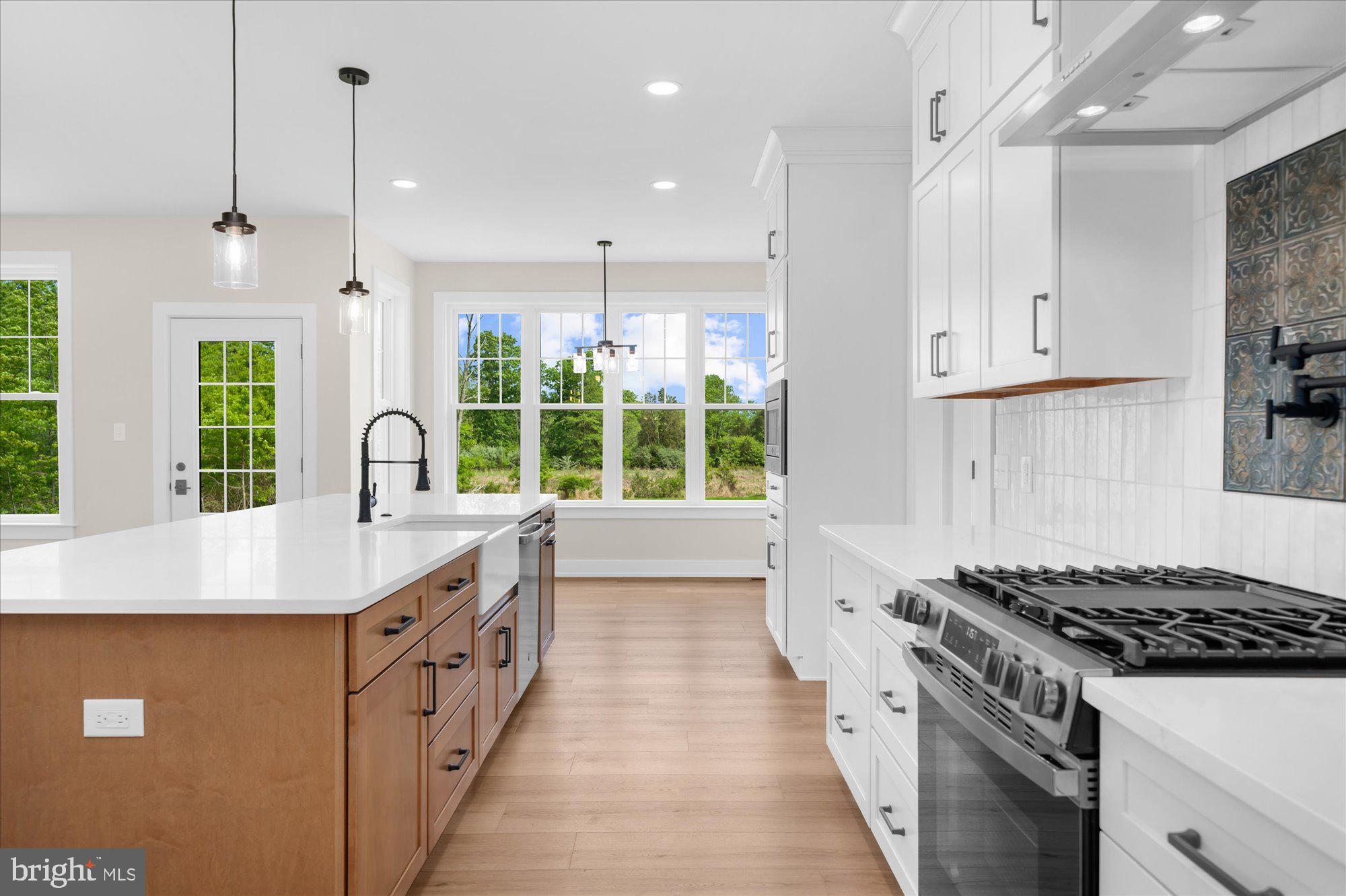 394 Renninger Road Perkiomenville, PA 18074 - Photo 2 of 41 a kitchen with granite countertop a stove and a sink