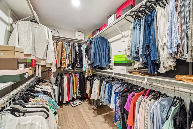 a bathroom with a granite countertop toilet sink and mirror