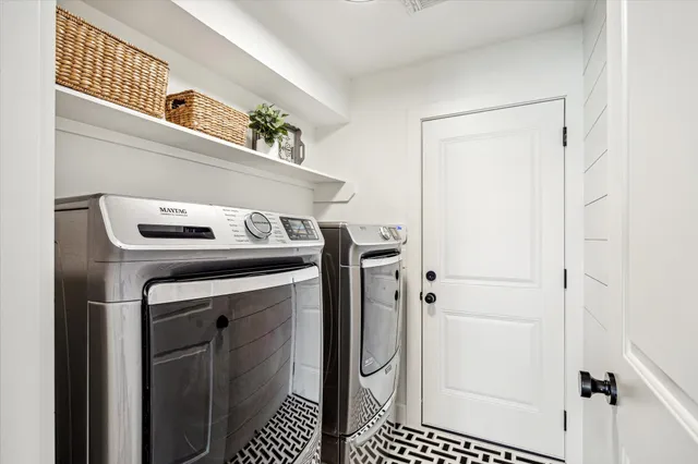 a front view of a house with a yard table and chairs