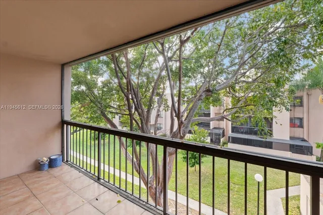 a view of a garden from a balcony