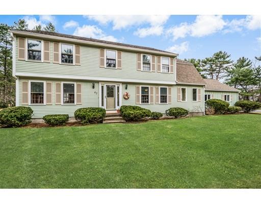 67 Wildwood Road Stow, MA 01775 - Photo 1 of 30 a front view of a house with a yard