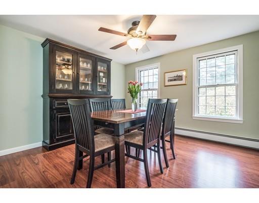 67 Wildwood Road Stow, MA 01775 - Photo 11 of 30 a view of a dining room with furniture wooden floor and chandelier