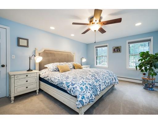 67 Wildwood Road Stow, MA 01775 - Photo 14 of 30 a bedroom with a bed chandelier and a window