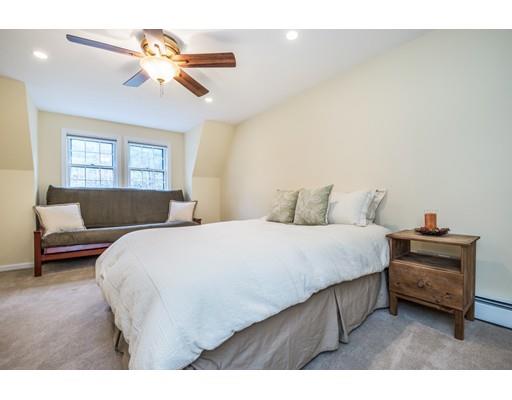 67 Wildwood Road Stow, MA 01775 - Photo 17 of 30 a bedroom with a bed a window and a couch