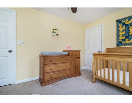 67 Wildwood Road Stow, MA 01775 - Photo 23 of 30 a room with a baby crib and dresser