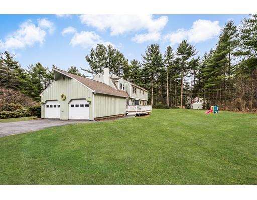 67 Wildwood Road Stow, MA 01775 - Photo 26 of 30 a view of a house with backyard and garden