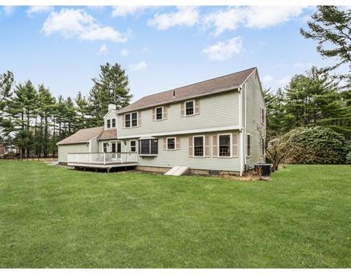 67 Wildwood Road Stow, MA 01775 - Photo 29 of 30 a white house that has a big yard and more windows