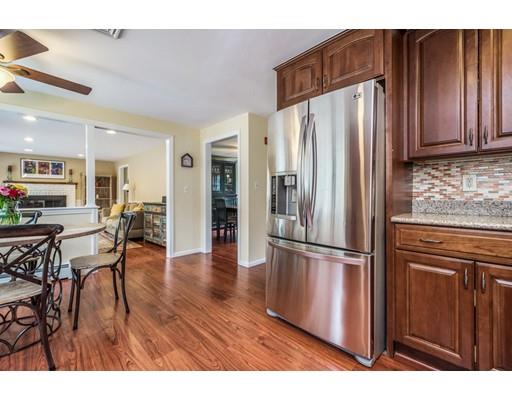67 Wildwood Road Stow, MA 01775 - Photo 3 of 30 a kitchen with stainless steel appliances granite countertop a refrigerator and a stove top oven