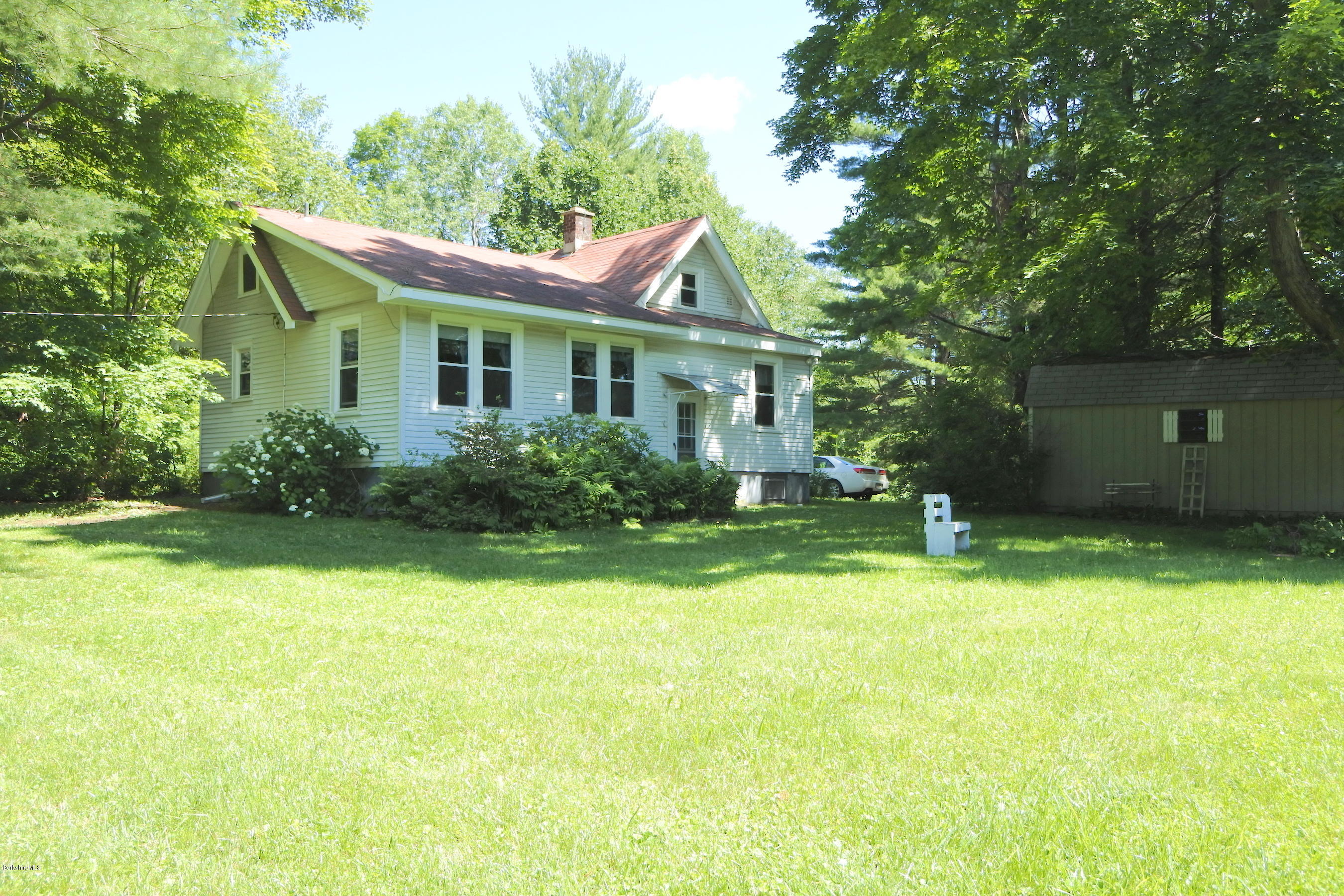 2609 State Road Richmond, MA 01254 - Photo 7 of 22 a front view of a house with garden