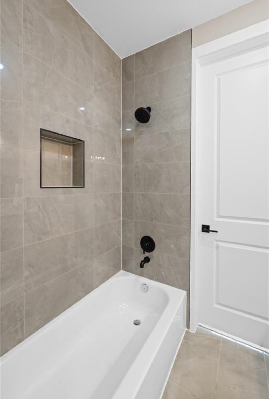 2610 Piemonte Ave Spring Spring, TX 77388 - Photo 8 of 10 a bathroom with a tub and shower
