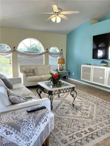 a living room with furniture and a flat screen tv