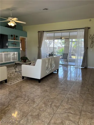 a view of a dining room with furniture and window