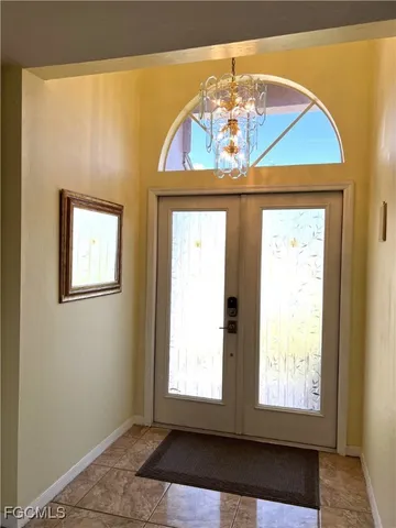 a bathroom with a toilet and a mirror