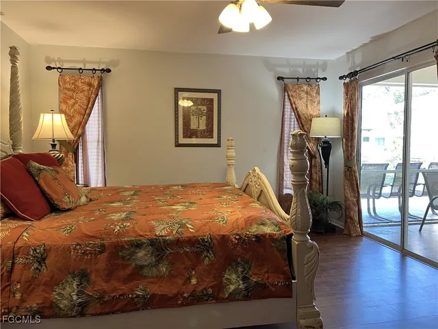 a bathroom with a granite countertop sink a large mirror and a shower