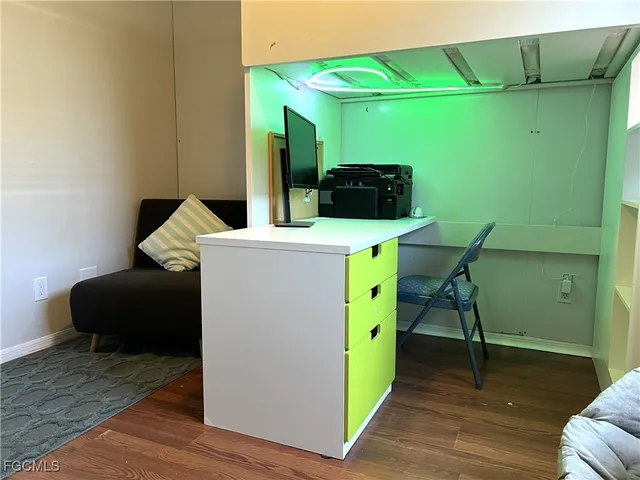 an aerial view of a house with swimming pool and outdoor seating