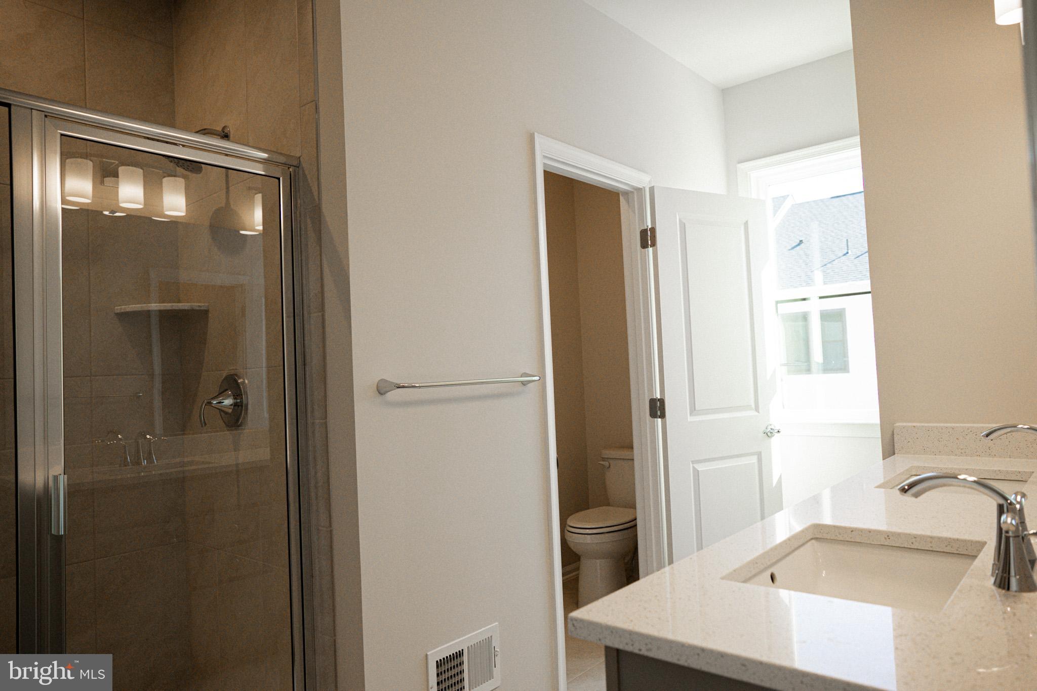 238 Mainstream Drive Laurel, MD 20724 - Photo 11 of 45 a bathroom with a sink and a mirror