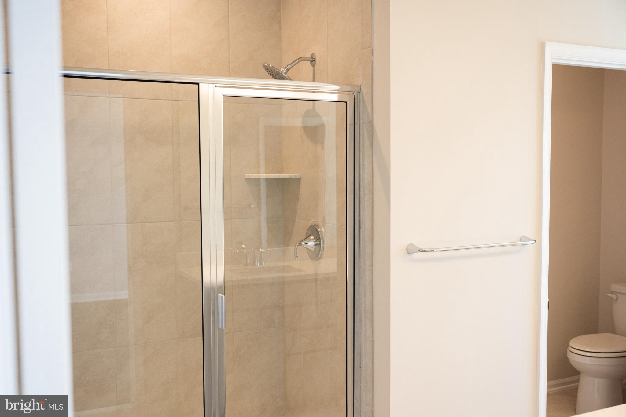 238 Mainstream Drive Laurel, MD 20724 - Photo 12 of 45 a bathroom with a shower and a toilet