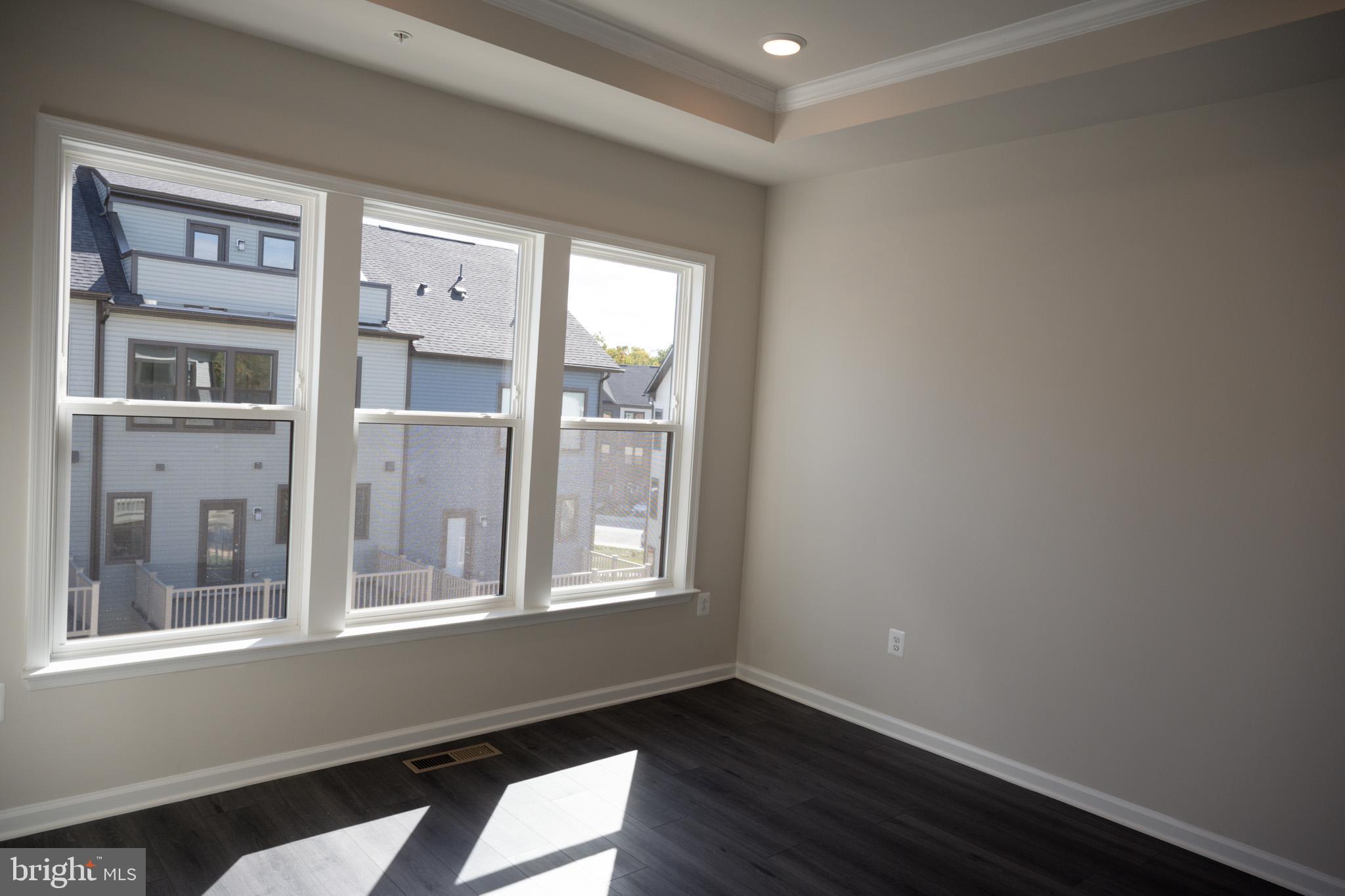 238 Mainstream Drive Laurel, MD 20724 - Photo 13 of 45 a view of a room that has a window and wooden floor