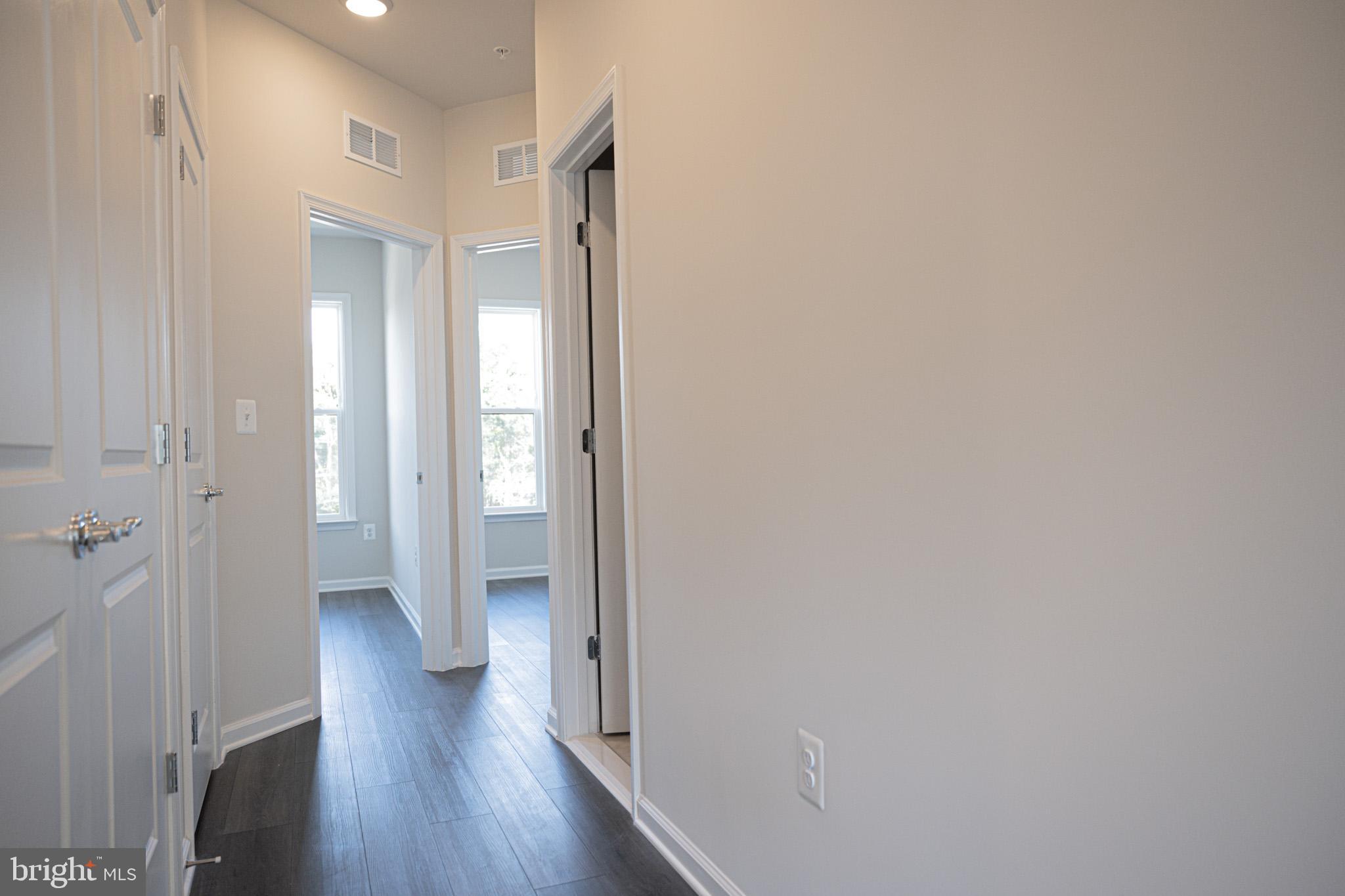 238 Mainstream Drive Laurel, MD 20724 - Photo 40 of 45 a view of a hallway with wooden floor