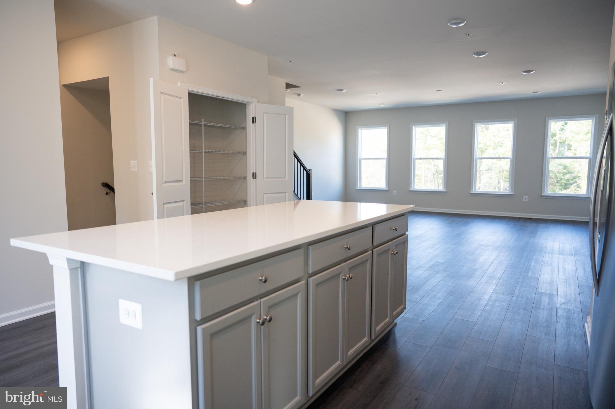 238 Mainstream Drive Laurel, MD 20724 - Photo 6 of 45 a view of a kitchen counter space with wooden floor