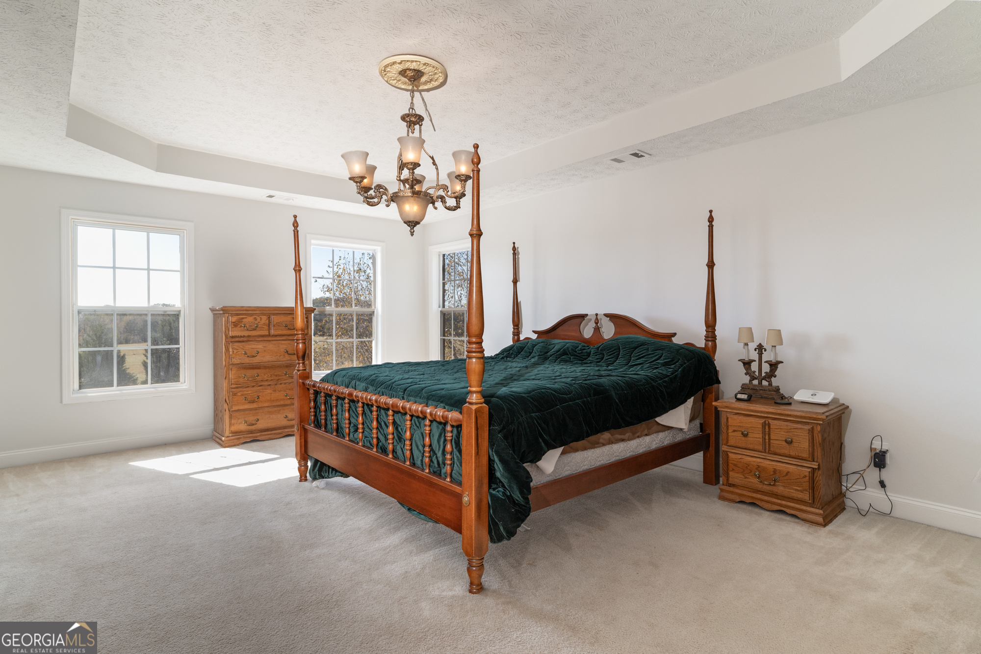 724 Teamon Road Griffin, GA 30223 - Photo 37 of 50 a bedroom with a bed lamp and a window