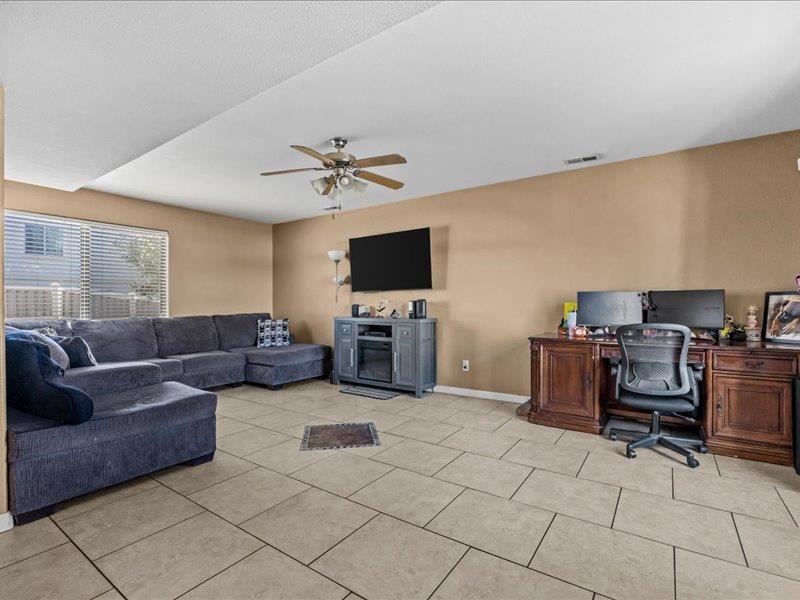 2860 B B 3/4 Road Grand Junction, CO 81503 - Photo 9 of 29 a living room with furniture and a flat screen tv