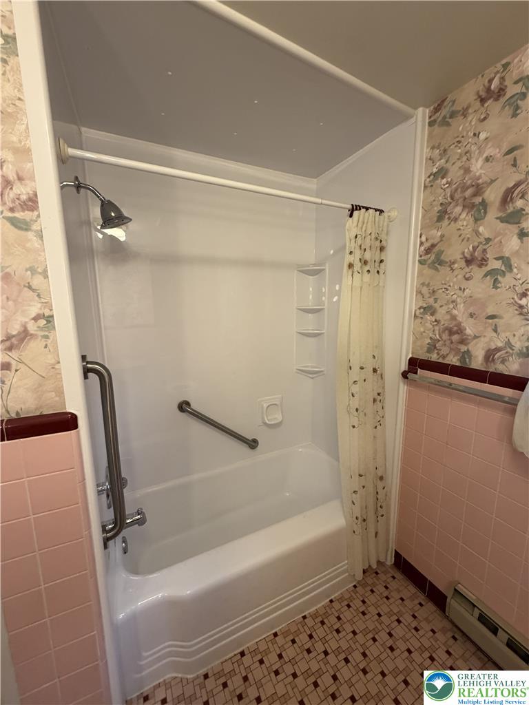 5391 Chapmans Road, Unit 2 Orefield, PA 18069 - Photo 7 of 22 A well-maintained bathroom with a tub and shower combo, offering practicality and ease of use.