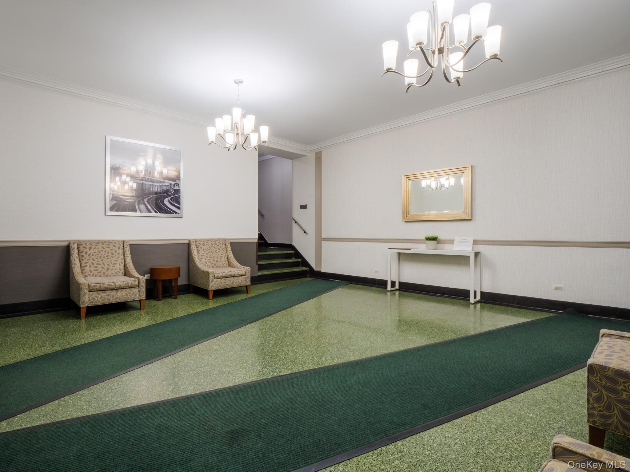 34-15 74th Street, Unit 4H Queens, NY 11372 - Photo 17 of 19 a living room with furniture wooden floor and a chandelier