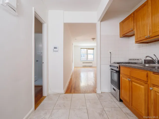 a view of a kitchen from the hallway